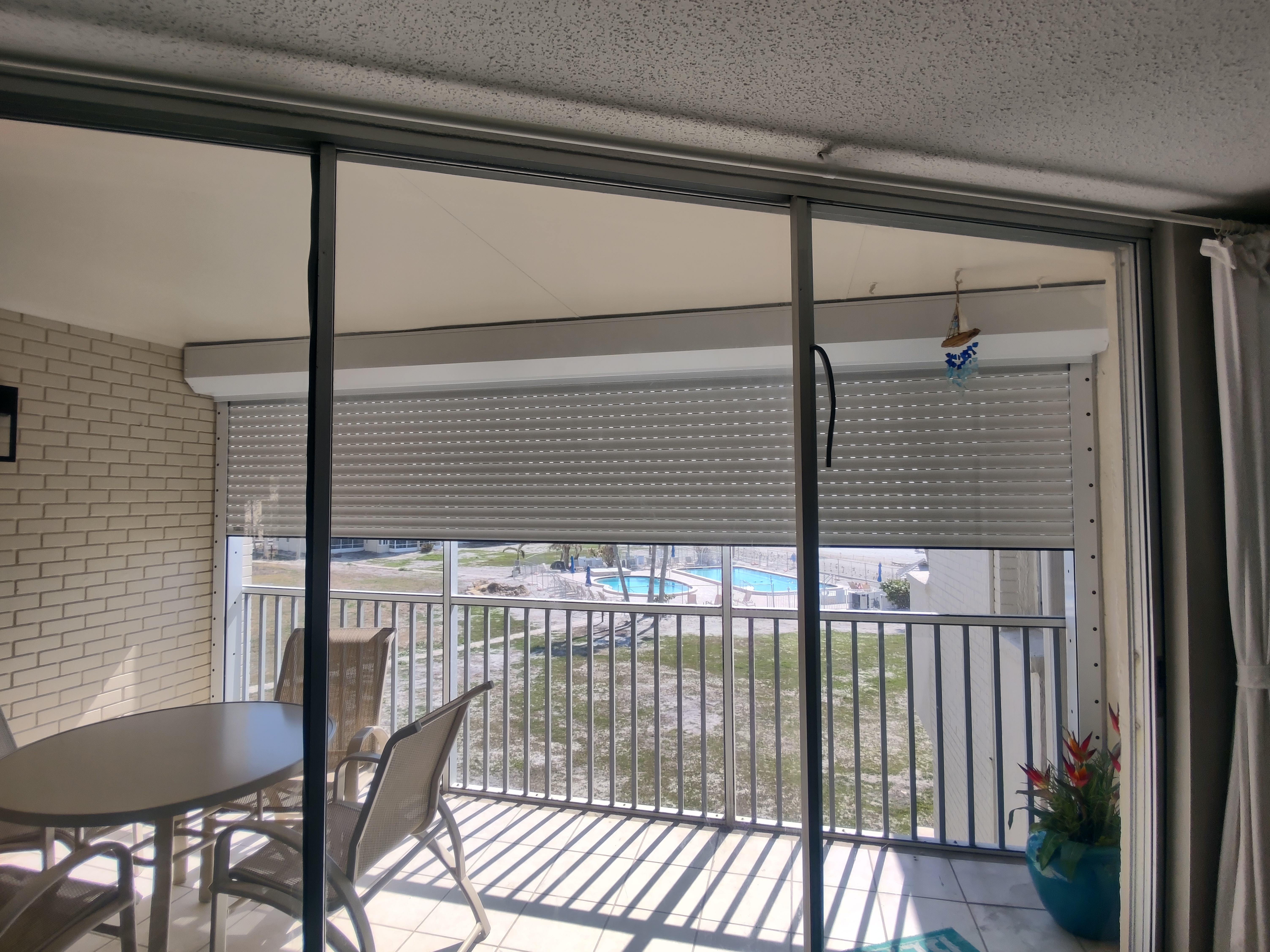 Roll-down shutters installed on a Sarasota condo balcony