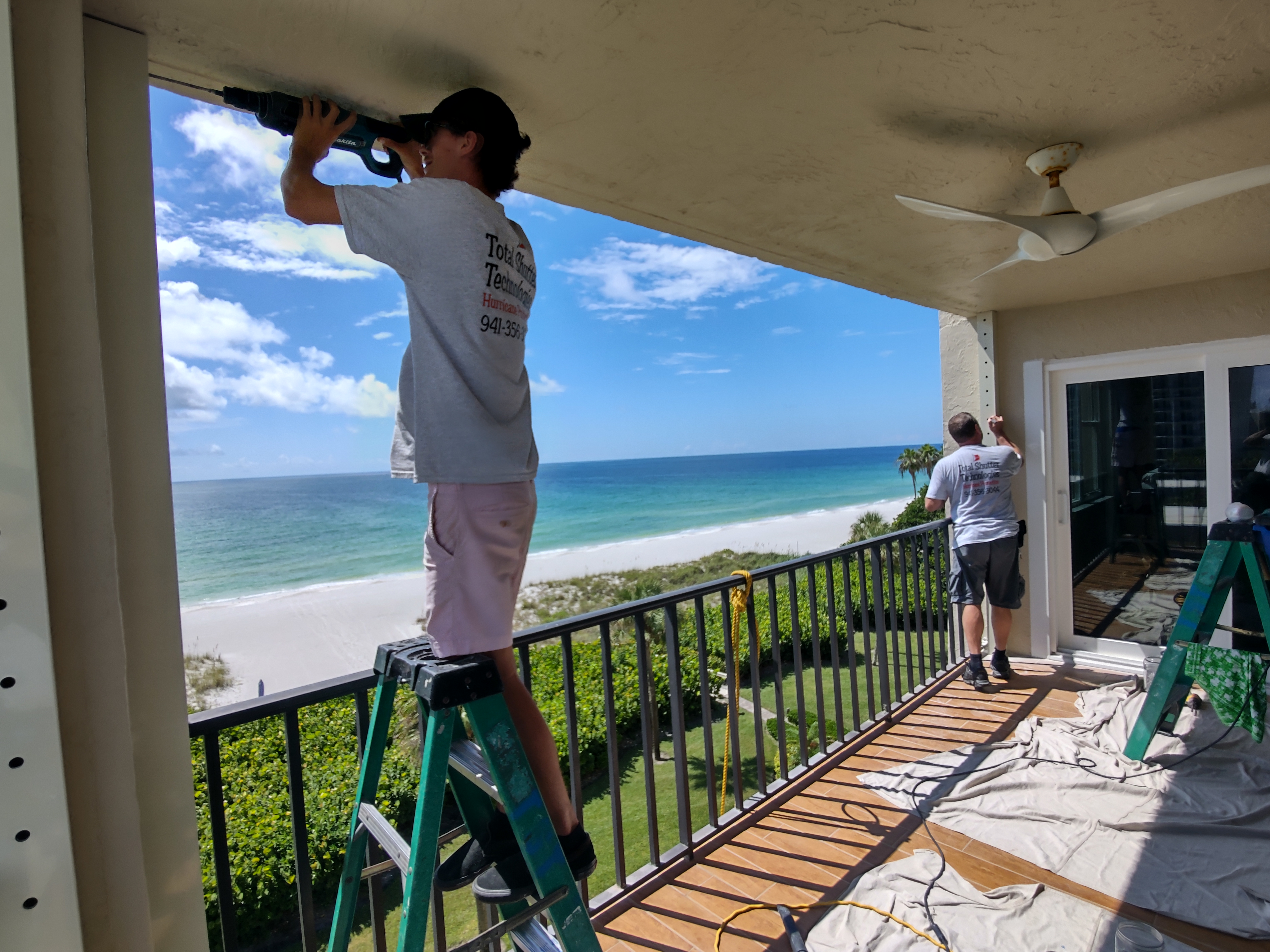 Motorized hurricane-rated retractable screen installation on a Sarasota home