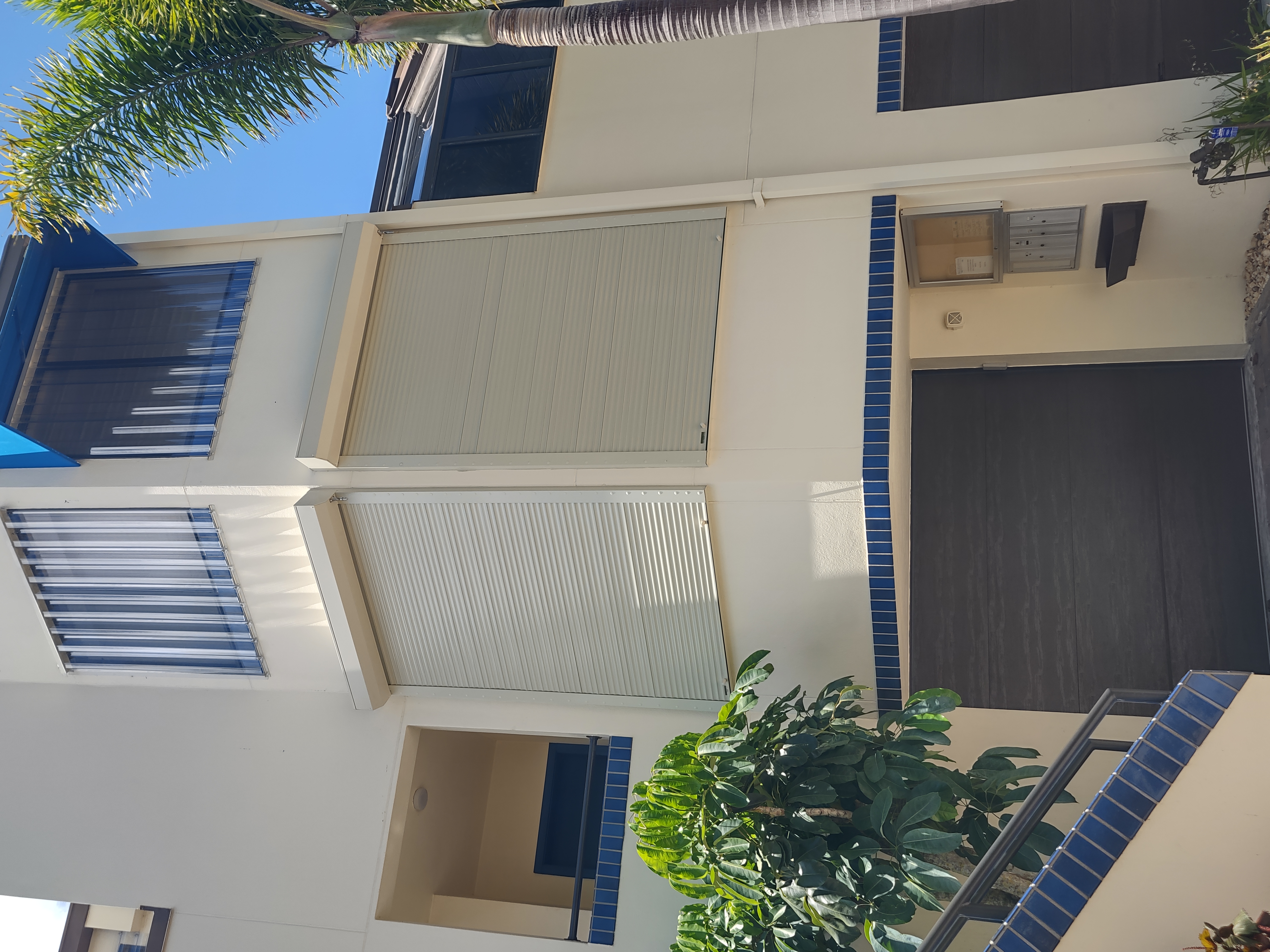 Roll-down hurricane shutters on a Sarasota townhome