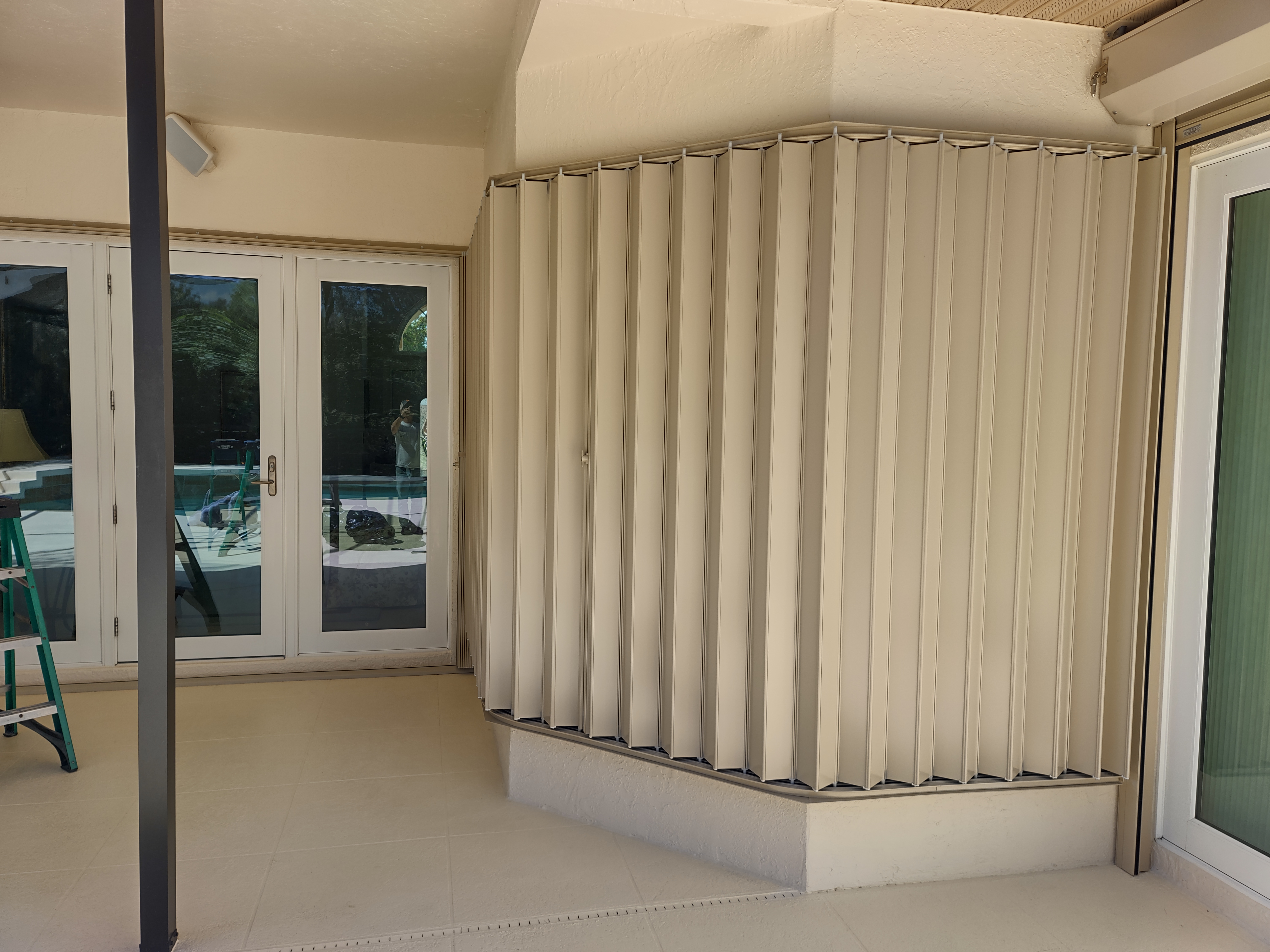 Accordion hurricane shutters installed on a Sarasota home